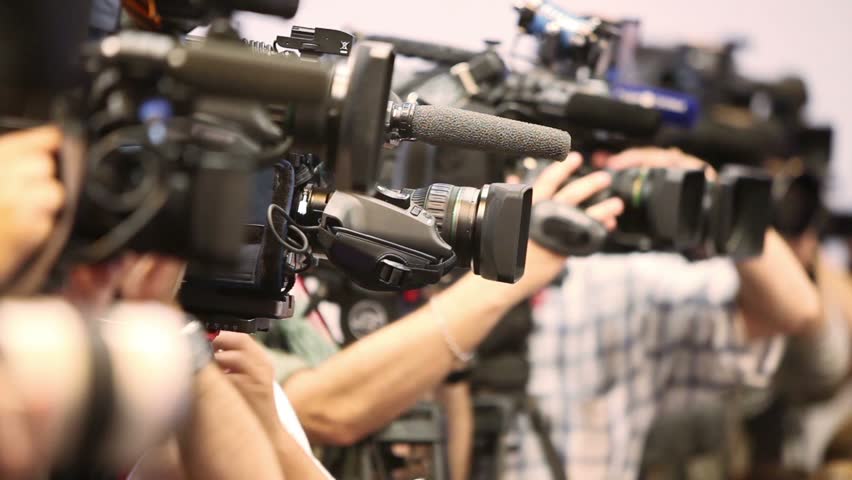 Several video operators with camcorders on tripods recording video at an event | Shutterstock HD Video #5534315