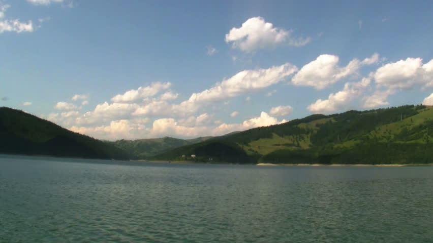 Timelapse clouds and mountain lake