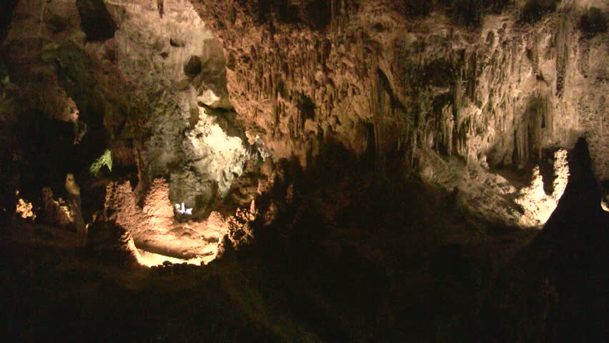 Video of Carlsbad Cavern National Park in New Mexico. Large chamber with mineral formations. Inside cave at about 750 feet underground. Colorful formations with lights. Rekindle Photo
