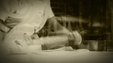 Dough roller-pin strudel making process old film effect Stock Video