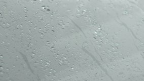 Rain falling on window glass,drops slide down car windshield. Rainy day, all seasons shot, droplets sliding down the car windshield, macro, close up shot. - Powered by Shutterstock - Get 15% off with code: PIKWIZARD15