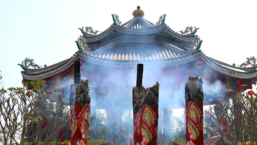 Huge joss stick, Chinese house background.