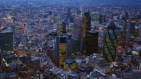 4K Aerial shot of Central London with a view of the City Financial District, Liverpool Street, Gherkin, at dusk
