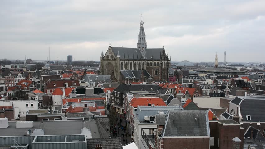 Grote kerk (big church) raising above small houses in Haarlem, Netherlands