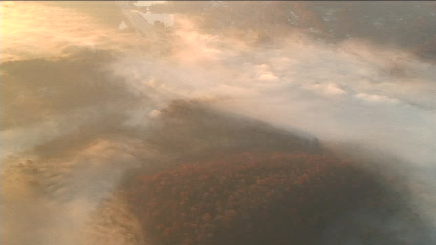 Sun rises highlighting Early Morning fog, flying over westchester county, NY