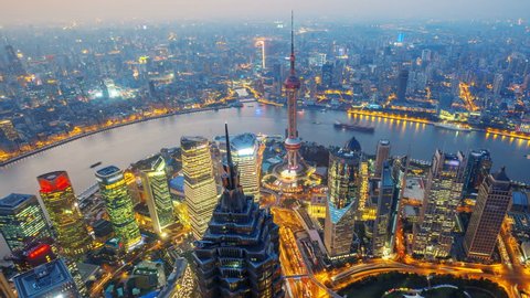 Shanghai from day to night (Panning Shot, 4k Time-Lapse).  Aerial view of high-rise buildings with Huangpu River in Shanghai, China. - >>> Please Search Newest Featured Similar Clip: 1020262945. 