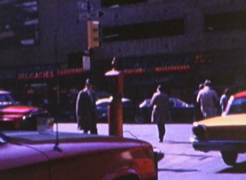 NEW YORK - CIRCA 1960s: Downtown New York City in the 1960s (specific year unknown). Shot from inside a taxi handheld. 