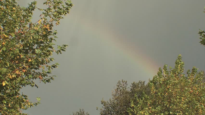 rainbow at rainy sky