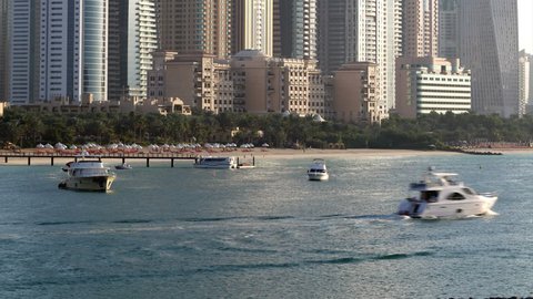 day light time lapse  from the palm on skyscrapers in dubai marina