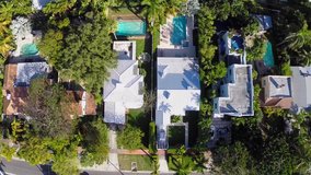 Aerial video of houses with swimming pools