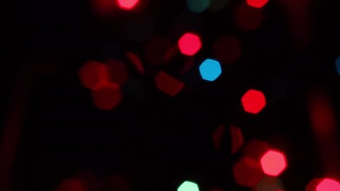blurred blinking christmas lights, vertical camera, dolly shot