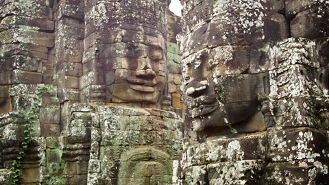 Video 1920x1080 - Huge stone faces on the towers of the ancient temple. Bayon. Angkor. Cambodia