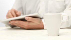 Man using tablet computer during coffee break - Powered by Shutterstock - Get 15% off with code: PIKWIZARD15