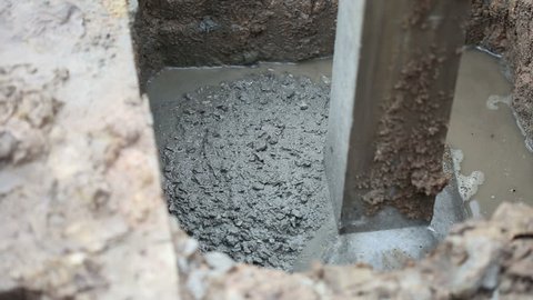 Concrete pouring to base of the pole for building a house