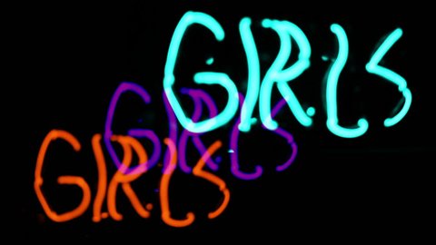 Girls neon sign, prostitution or peep show concept