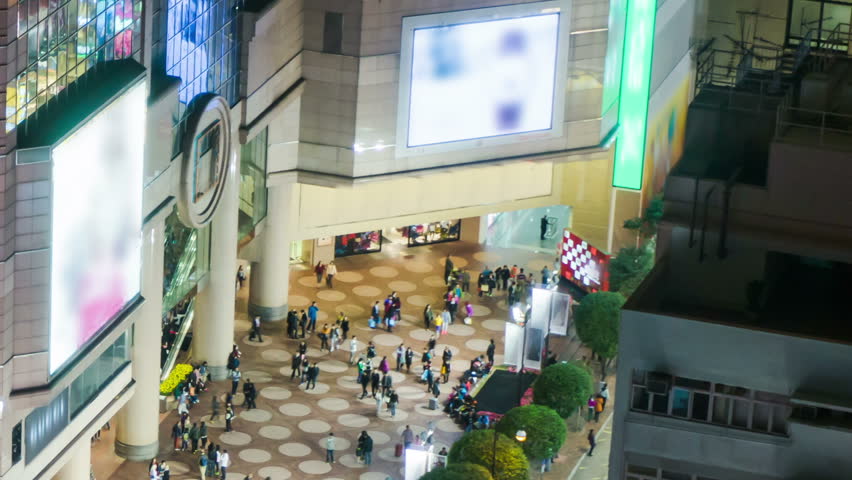 People on the opening space of a shopping mall. Tight tilt down shot.  Time lapse of people on the open space of a shopping mall. Top shot or aerial shot. 