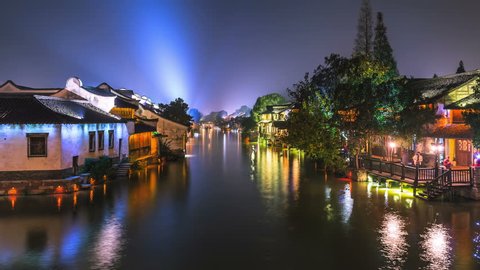 4K Video: Night time-lapse of ancient town in China.  Wuzhen, a 1300-year-old water town, is a national 5A scenic area and one of China???s top ten historical & cultural towns. 库存视频
