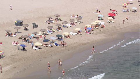 Beach in Spain - Low shot of people on beach in Spain