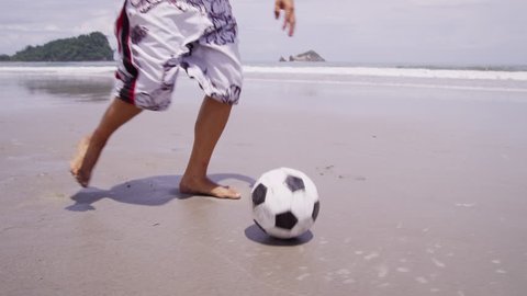 Man kicking soccer ball at beach, Costa Rica. Shot on RED EPIC for high quality 4K, UHD, Ultra HD resolution. Stock Video