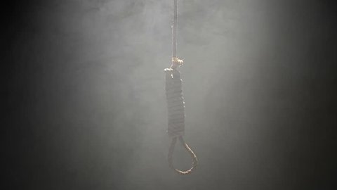 Falling Hangman Noose over black background and Heavy Smoke
