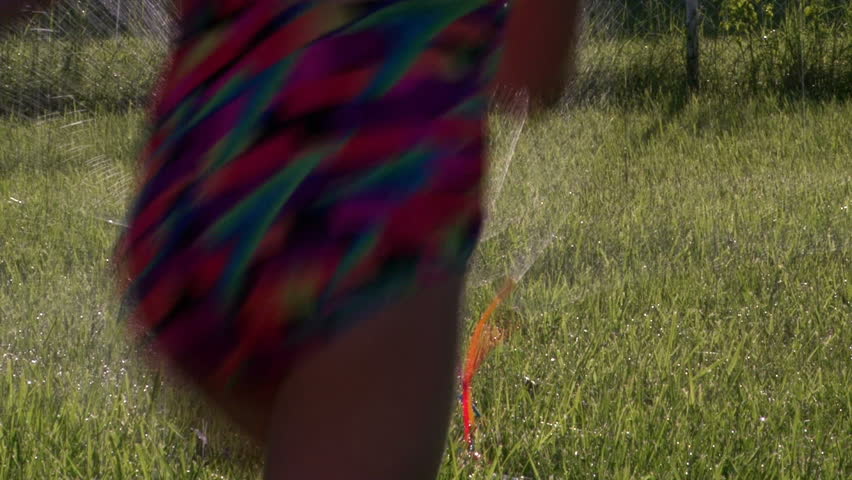 Kids Running through Sprinkler