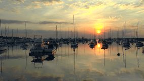 beautiful sunset at manila bay philippines with luxury yachts snd sailboats, hd clip

