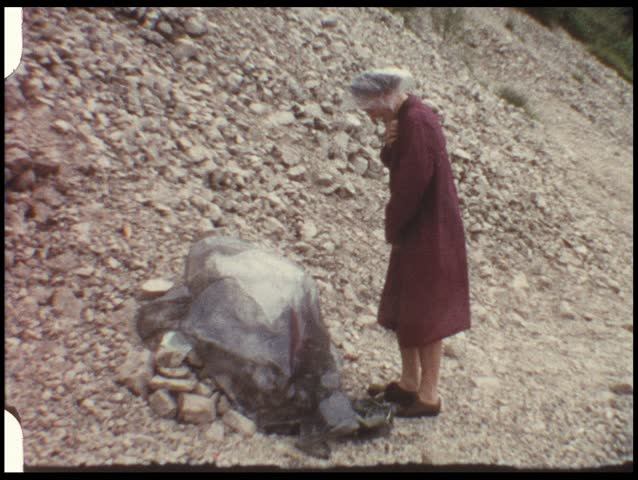 Woman changing before swimming (vintage 8 mm film)