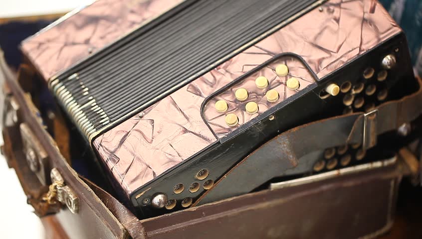 old accordion in a suitcase