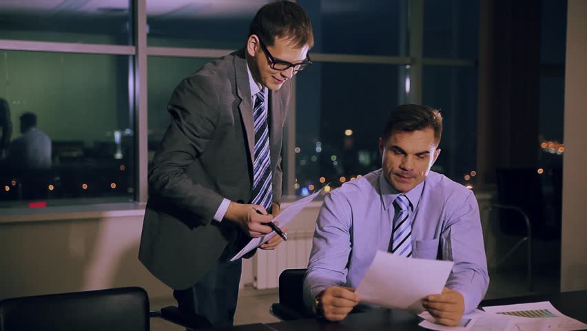 Two young businessmen communicating at meeting | Shutterstock HD Video #5614922