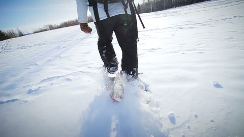 Epic Closeup of Woman Snowshoeing on a Beautiful Winter Day
