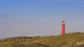 Lighthouse in the dunes at the island of Schiermonnikoog in the North of the Netherlands.
