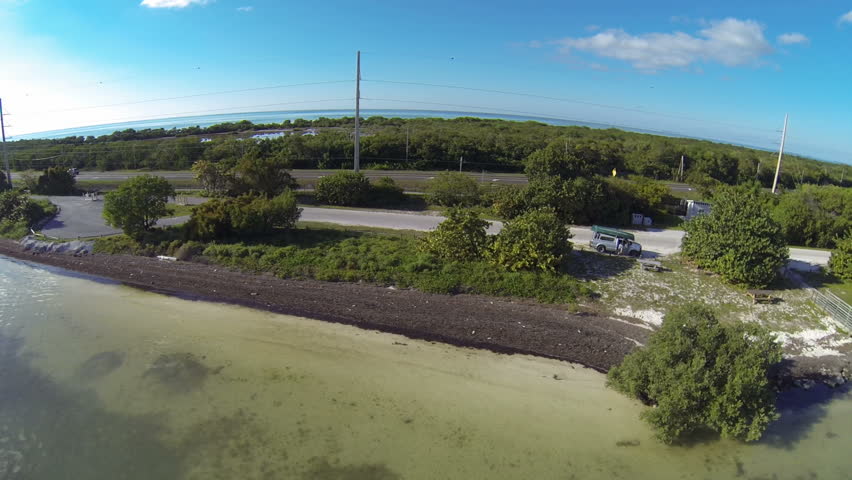 Florida Keys Aerial Footage. Flying along the shore of Long Key.