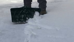 Shoveling snow by hand video clip