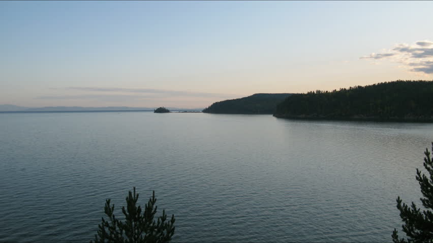 Time lapse of Sunset  on Baikal lake. Chivirkuy Bay. The Holy Nose Peninsula.