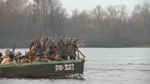 KIEV, UKRAINE - NOVEMBER 04, 2013 : 04.11.2013. Reconstruction of the hostilities of the Second world war in Kiev. The soldiers are forcing the Dnieper river near Kyiv, and attack the enemy.