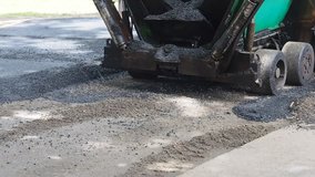 short video clip of bitumen being spread during road construction