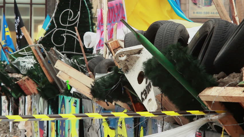 Revolutionary barricade of tyres pine trees bricks metal shields