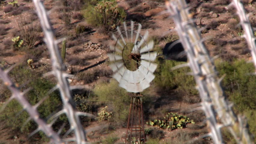 A windmill in the desert.