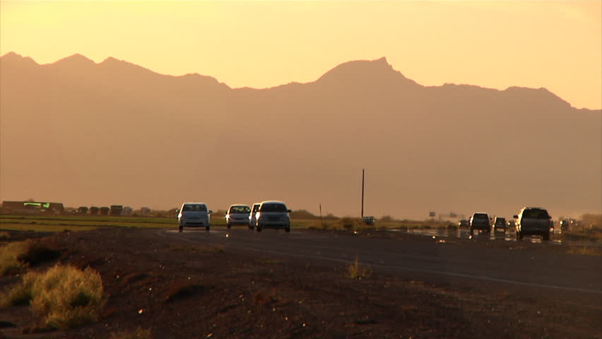Traffic on an Arizona highway at sunset.