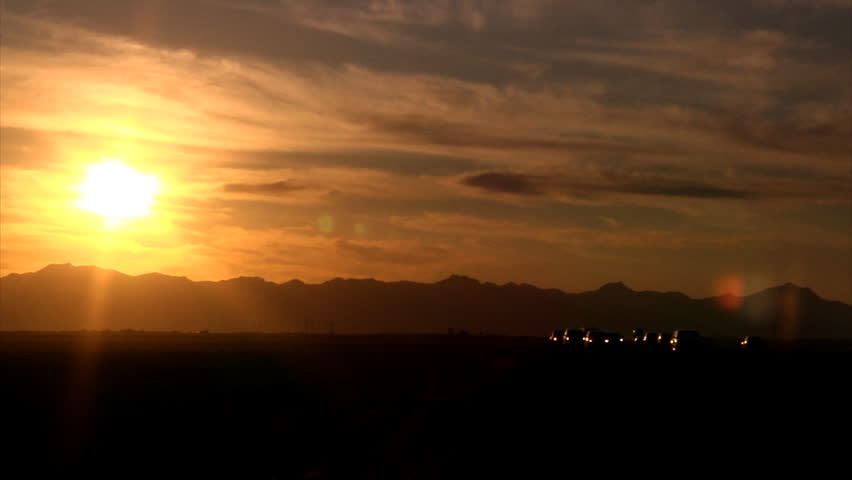Traffic on an Arizona highway at sunset.