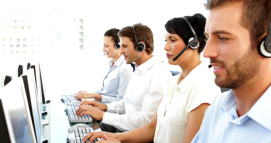 Smiling customer service agents working in the office | Shutterstock HD Video #5658581