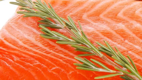 fresh raw red fish fillet on wooden plate and rosemary 1920x1080 intro motion slow hidef hd