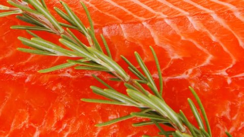 fresh raw red fish fillet on wooden plate and rosemary 1920x1080 intro motion slow hidef hd
