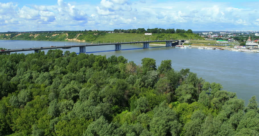 Aerial view. Flight over the river. Bridge over the river Ob. Barnaul suburb, Altai region, Siberia, Russia. Summer 2013