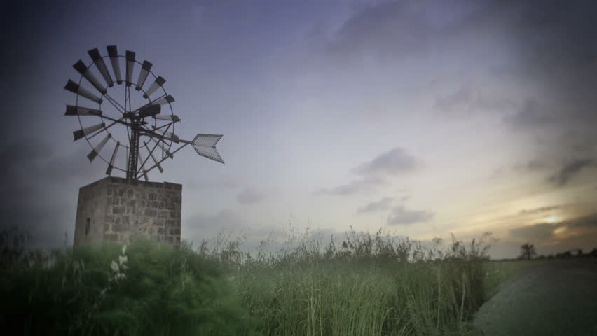 Beautiful Sunset and windmill time lapse. Natural colors. HDR.  4K.   