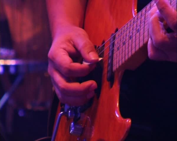 Musician play on guitar