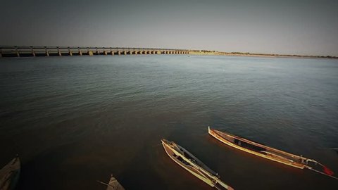 An aerial shot of traditional fishing boats along the banks of the River Indus
