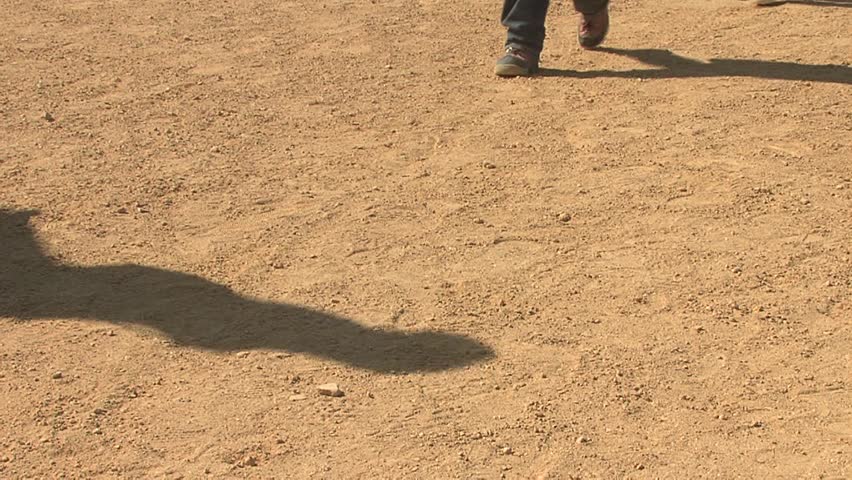 People walking in dirt