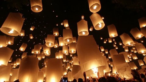 MAE JOE UNIVERSITY, CHIANGMAI, THAILAND - NOV 16: Yi Peng buddhist festival celebration, people launching thousands of flying lanterns in Chiang mai, Thailand on november 16, 2013