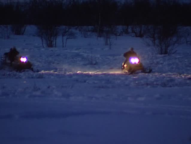 Snowmobile dragging sled